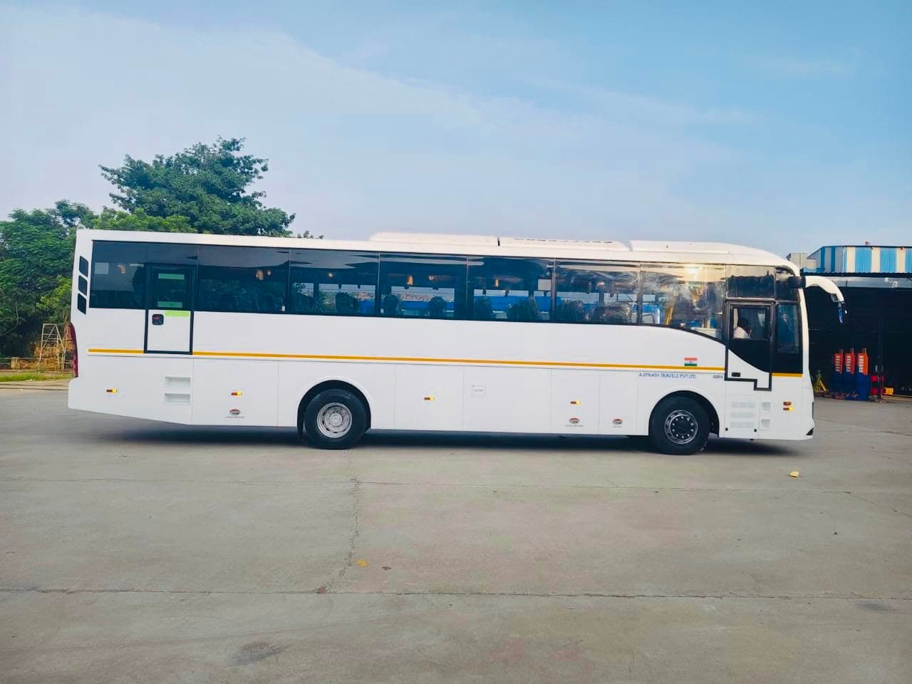 Qutbi Travels AC coach bus side profile